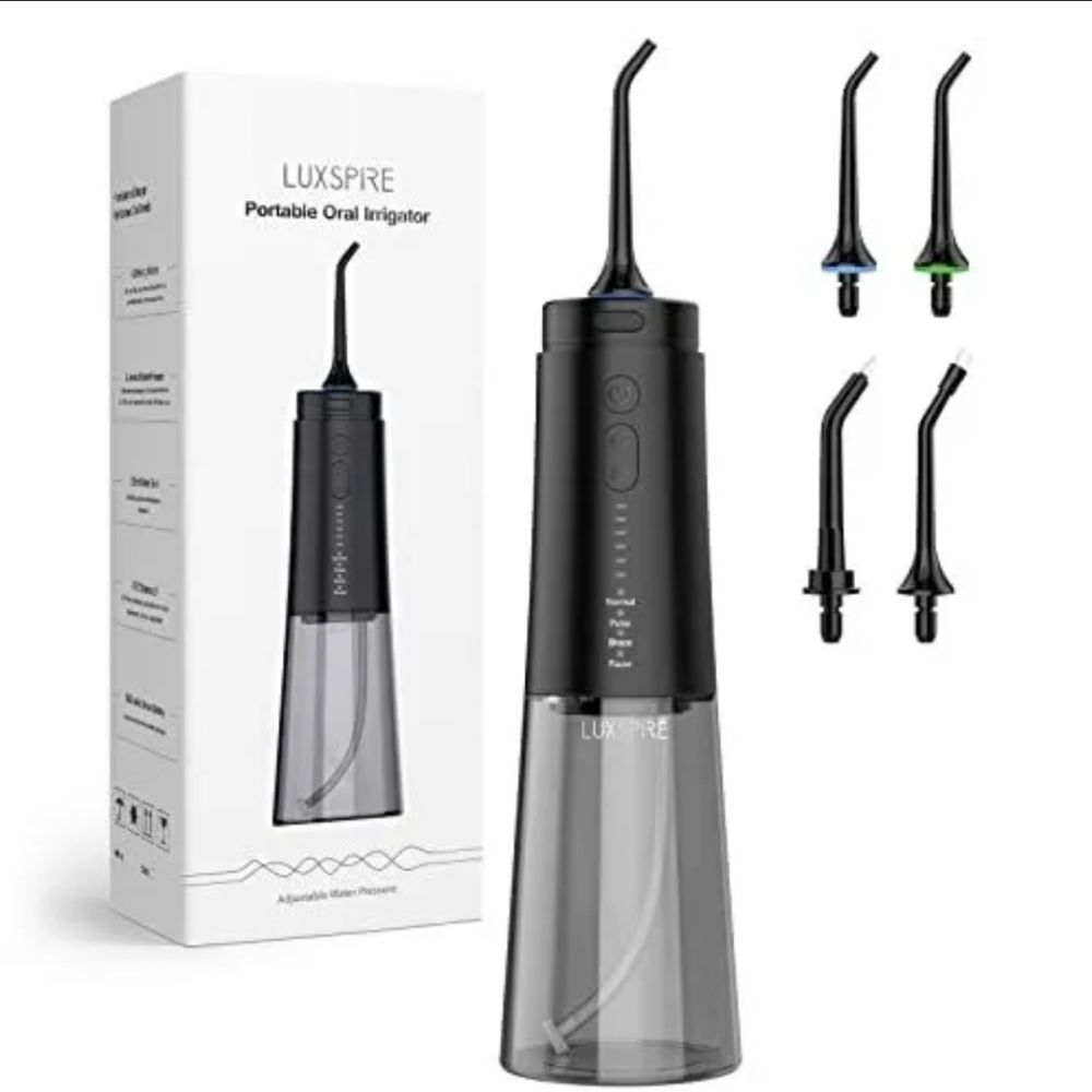 NIB. Embrace a brighter smile with this water flosser. 1 min per day. LUXSPIRE